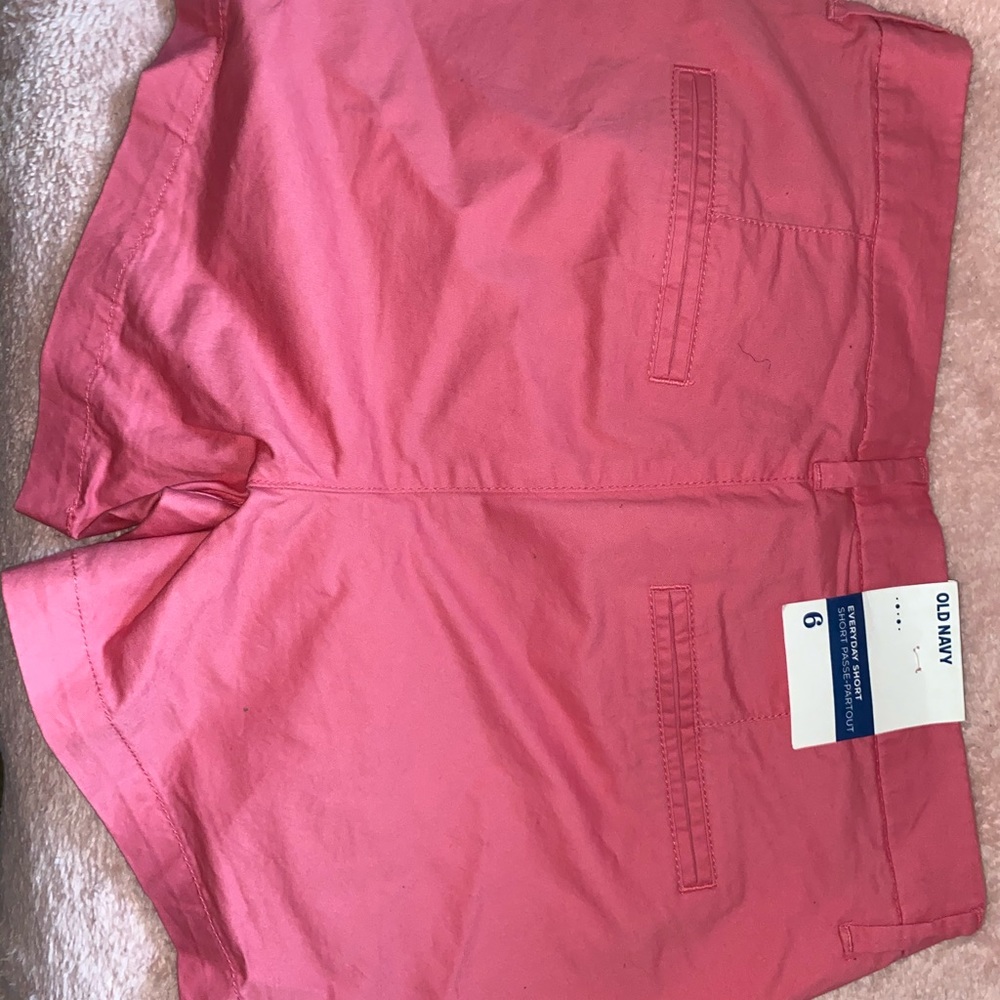 Pink shorts.